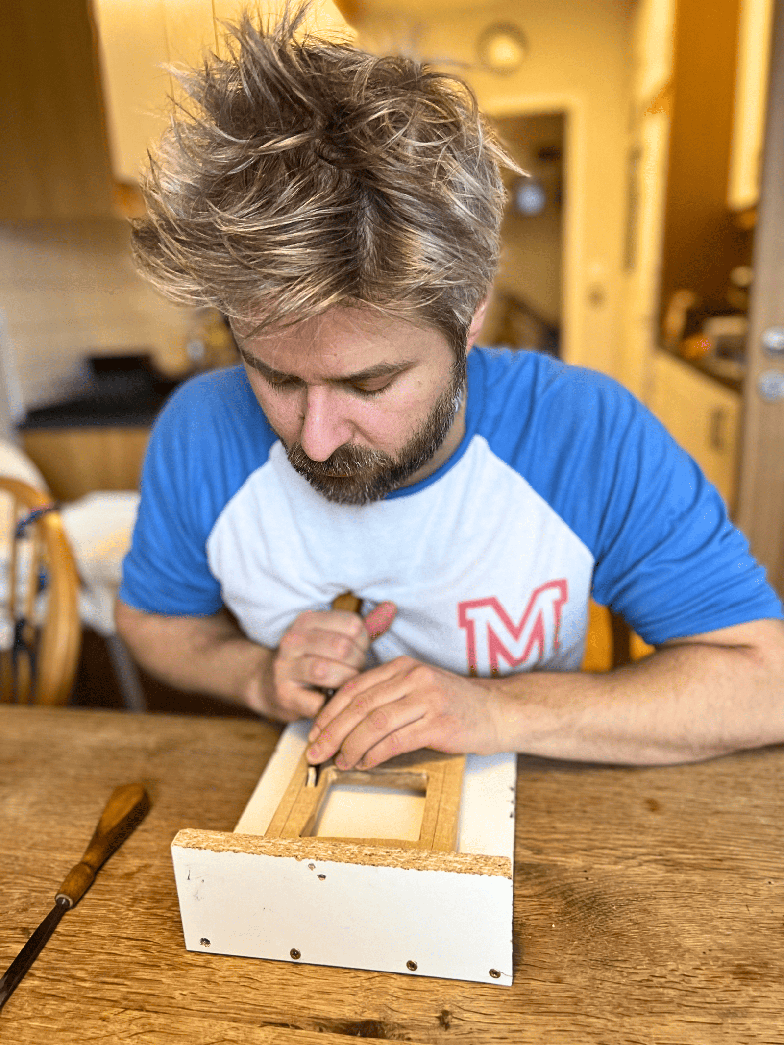 Handcrafted wooden box by Sebastian Ungh in a cozy workshop setting. Handcrafted wooden box by Sebastian Ungh for custom woodworking projects.